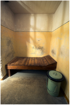 Inside a dark cell, single confinement.